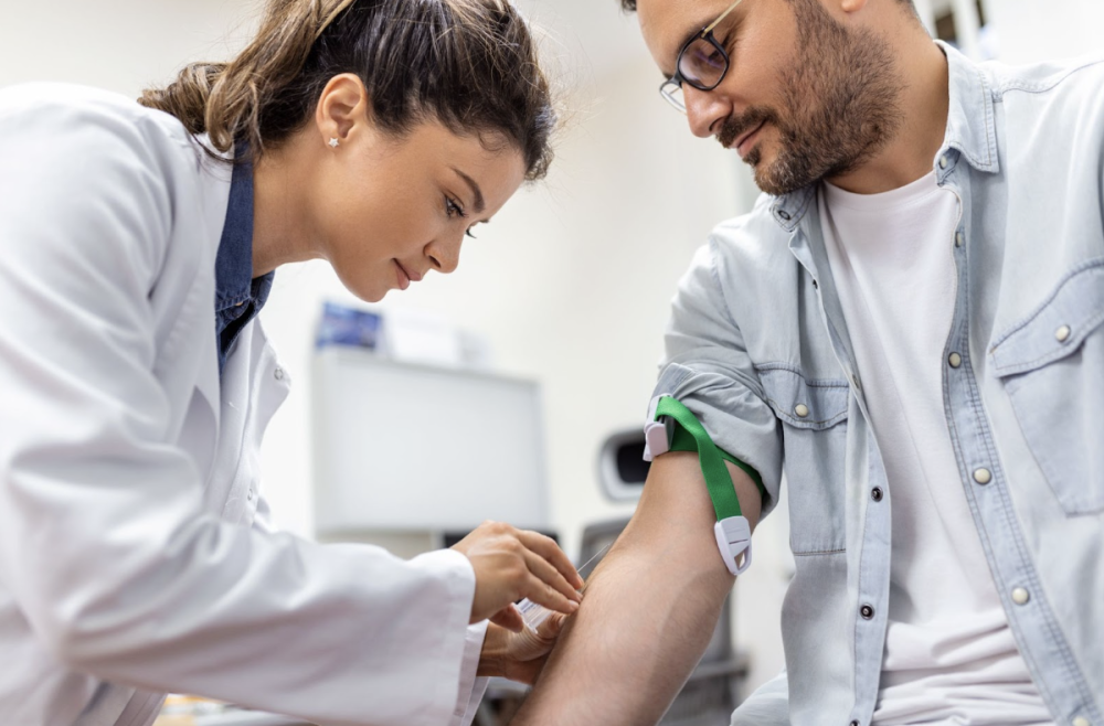 Blood draw collection by a phlebotomist in a Swindon clinic