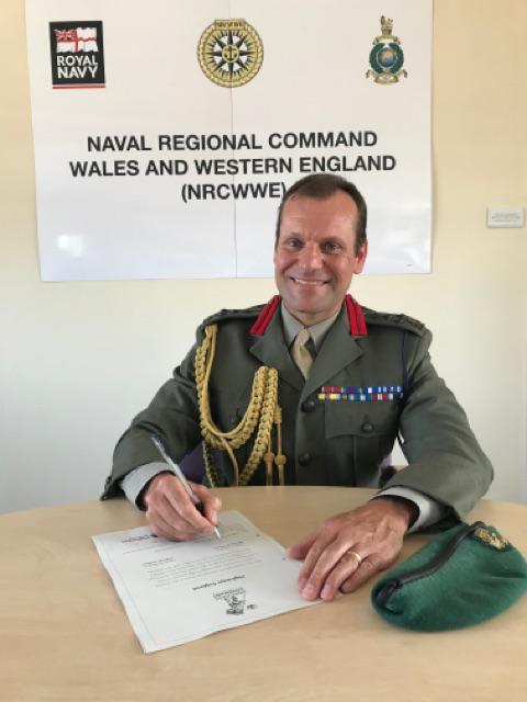 Brigadier Graeme Fraser Royal Marines, signs the Armed Forces Covenant on behalf of the Ministry of Defence.