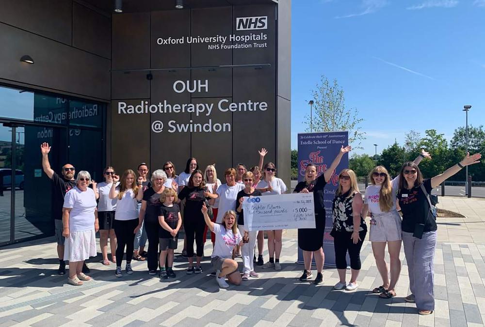 The Estelle School of Dance team with their cheque of £5,000 at the radiotherapy unit open day