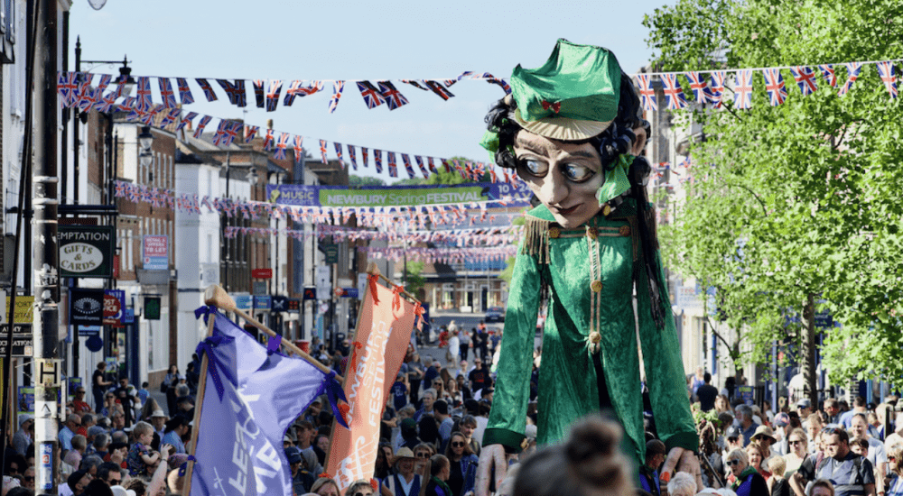 Bandmaster puppet makes its way through Northbrook Street to open Newbury Spring Festival 2025 - Photography copyright Milly March