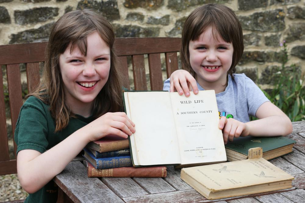 Beth, left, and Emily Scott with editions of Wild Life in a Southern County. Beth and Emily are daughters of Richard Jefferies Museum Trust chair Ann Marie Scott