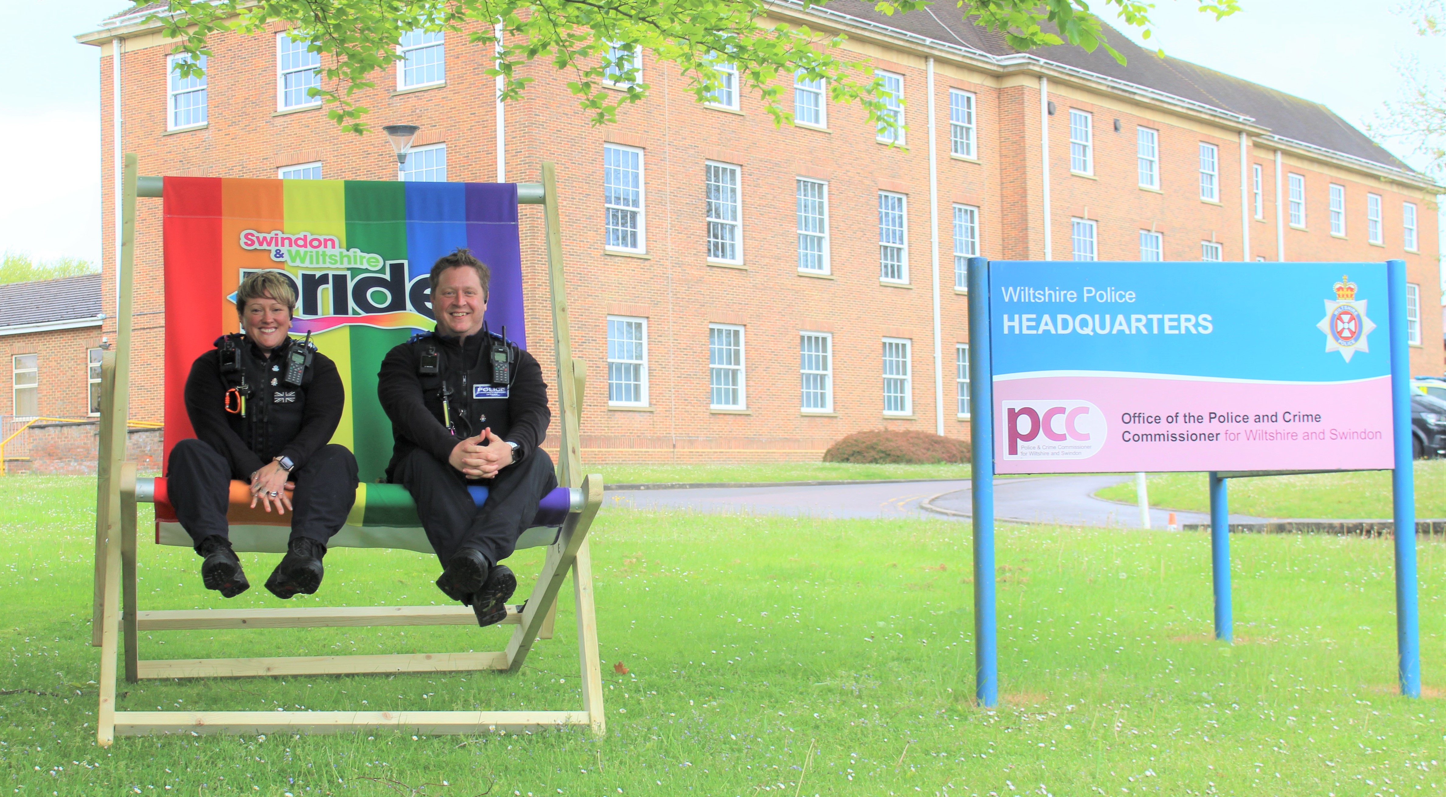 PCSOs Kate Jackson and Lee Hare trying the deckchair for size