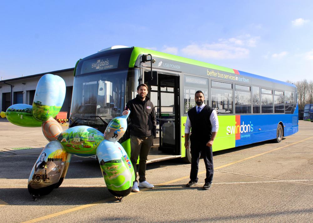 (L - R) Chris Hyde from Big Dog Art Trail with Swindon’s Bus Company’s Raheem Kahn and one of the Swindogs