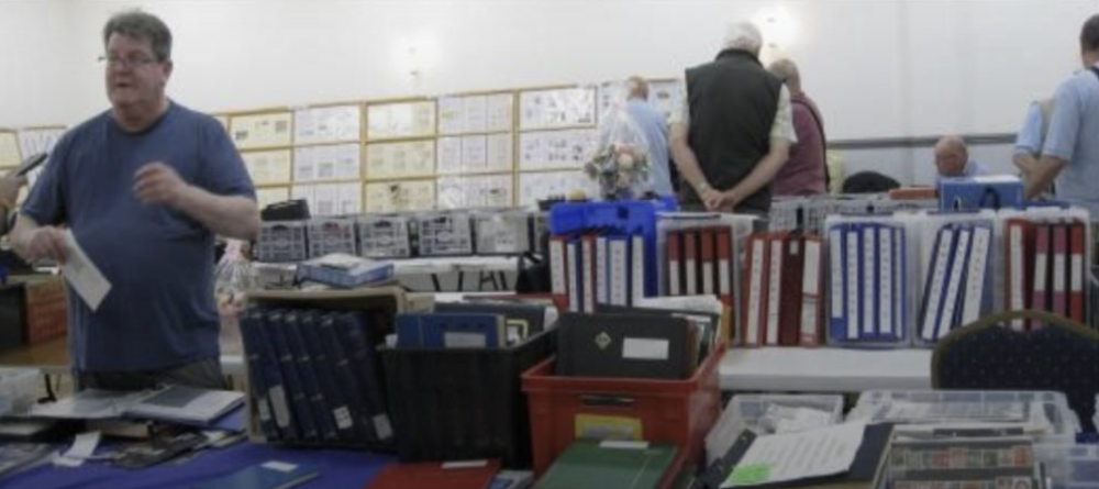 Philatelic dealer Martin Wybrow at last year's 'Swinpex'. In the background are the displays of winning entries in various Wiltshire & District Philatelic Association competitions. Photo by Pam Golding