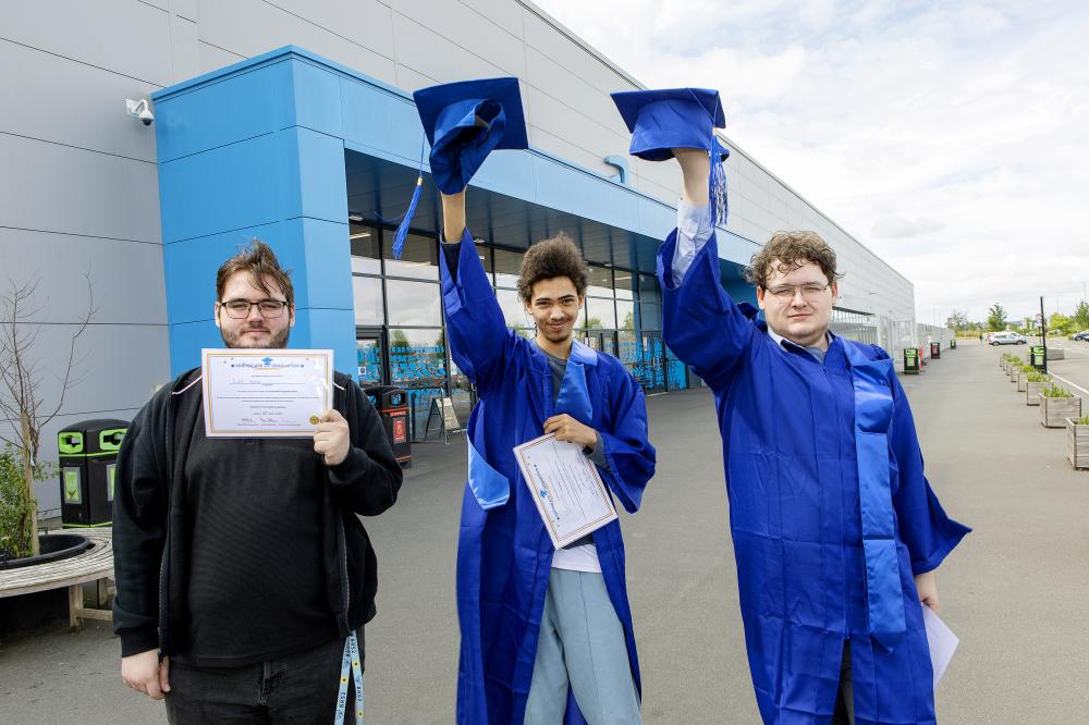 Jacob, centre, with fellow graduates