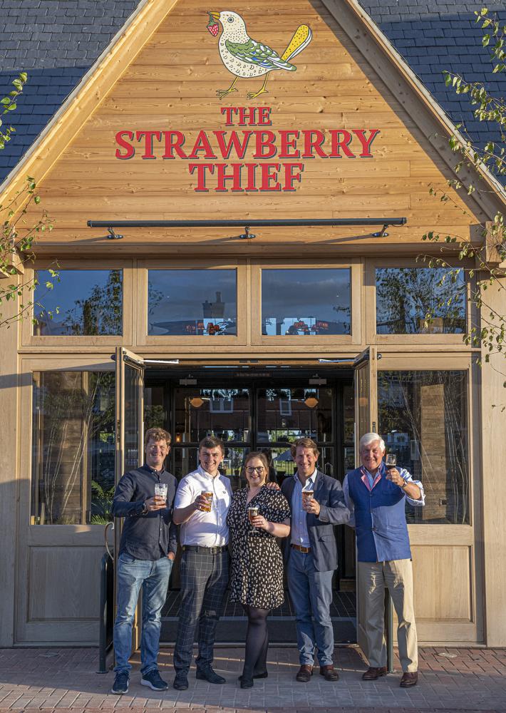 The Arkells team outside their new pub The Strawberry Thief