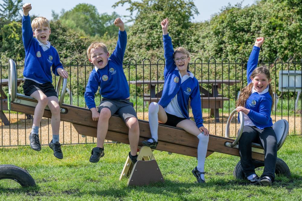 From leftL Freddie, Cooper, Charlotte and Tabitha from Kingfisher CE Academy officially launch Wichelstowe’s new play area
