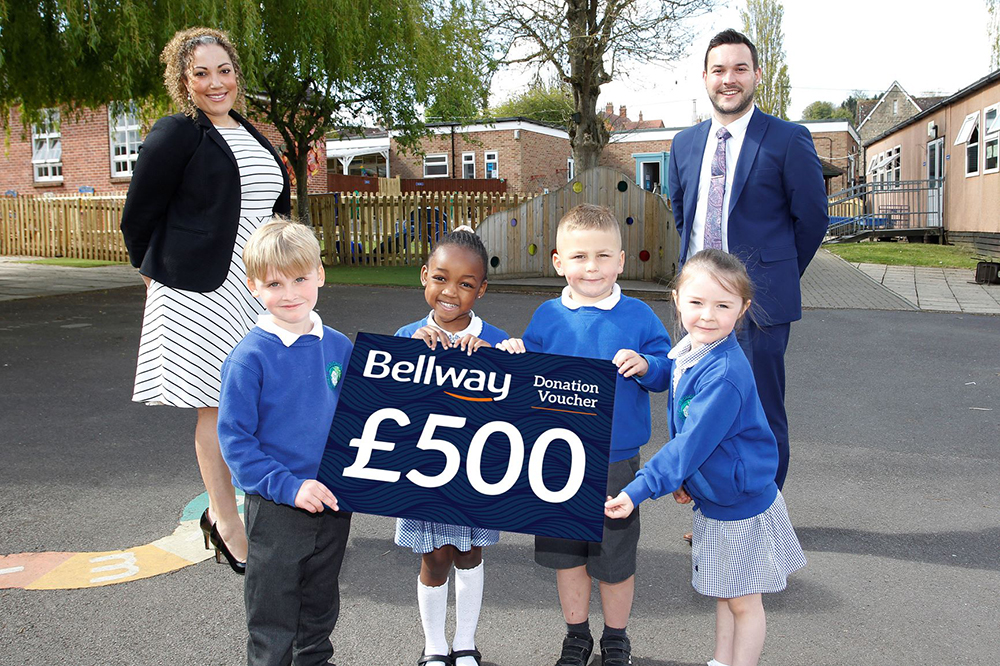 Christel Hawkins, Sales Manager of Bellway South West, Ashley Barrington-Wilding, Head of Wroughton Infant School and pupils