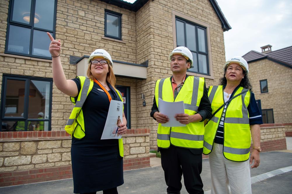 Avishek Subba and Renuka Subba are given a tour of the new homes at Redlands Grove by Bellway Sales Advisor Melanie Eggleton