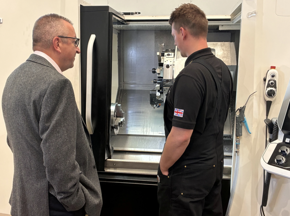Cllr Gary Sumner being shown one of Billet Precision's state-of-the-art machines by Director and Co-Founder Ryan King