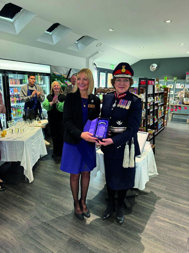 Lord Lieutenant of Wiltshire Sarah Rose Troughton presenting the King's Award to Maggie Banda, Chair, Blunsdon Community Shop