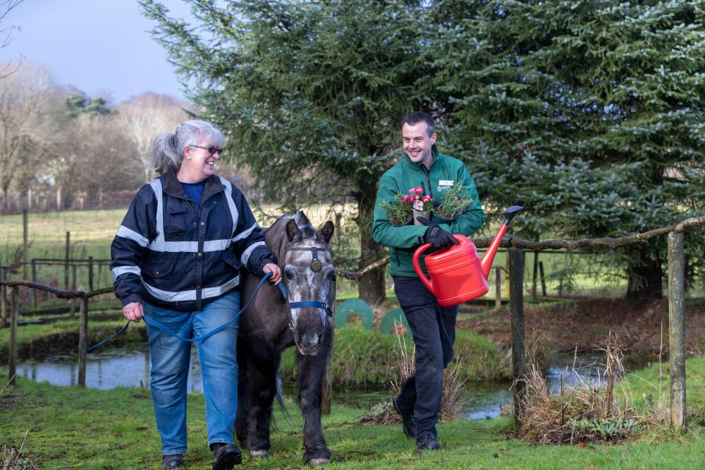 Lynda McKeeman, Yard Manager at Riding for the Disabled Association (RDA) Glasgow, Ambassador Smudge and Greg Dunsmore, Dobbies’ Milngavie Horticultural Manager (credit - Jeff Holmes)