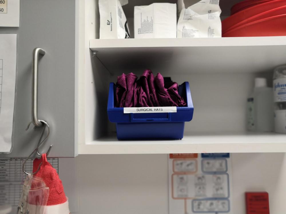 Reusable surgical hats on shelf at Eastcott Veterinary Referrals