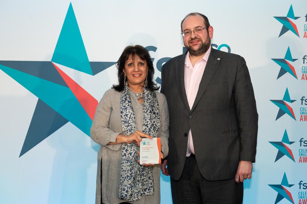 •	Keeping it in the family – Surinder Hothi-Bellamy accepts the FSB award as Family Business of the Year from FSB South West Policy Lead Iain Wallis from Devizes  