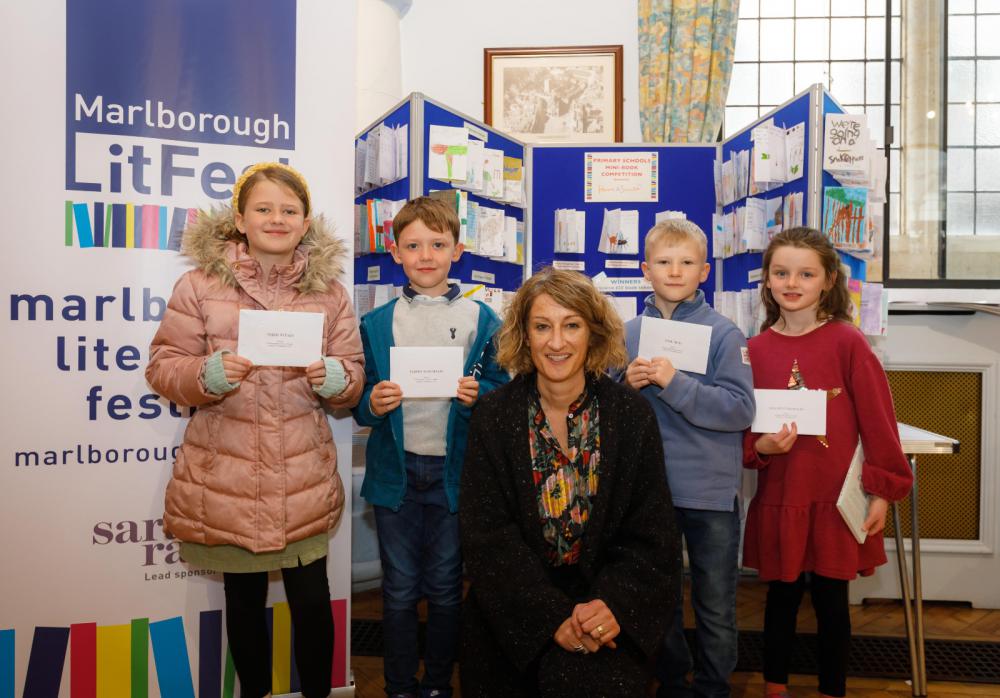 Four of the competition winners from Marlborough Literature Festival with children's author Emma Carroll who presented book token prizes donated by Haine & Smith