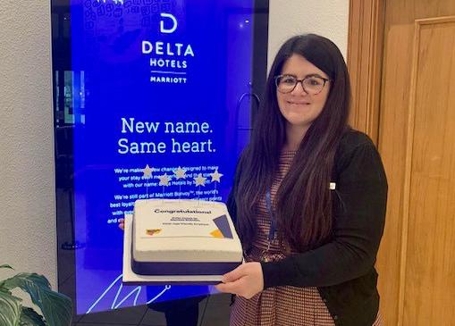 Delta Hotels by Marriott Swindon Human Resources Manager Caroline Alexander with a celebratory cake