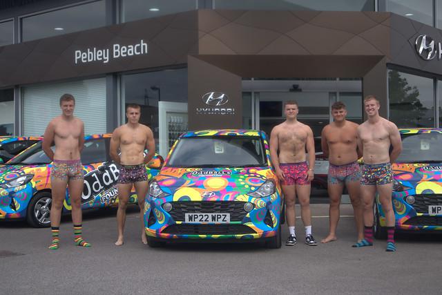 Oddballs ambassadors strip down to receive their specially wrapped cars