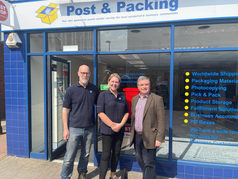 South Swindon MP Sir Robert Buckland, right, with Darren and Shani of Post and Packing