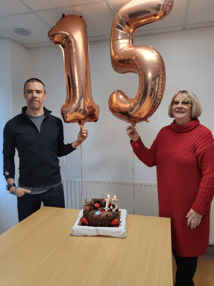 Nick and Gail with their celebratory balloons and cake