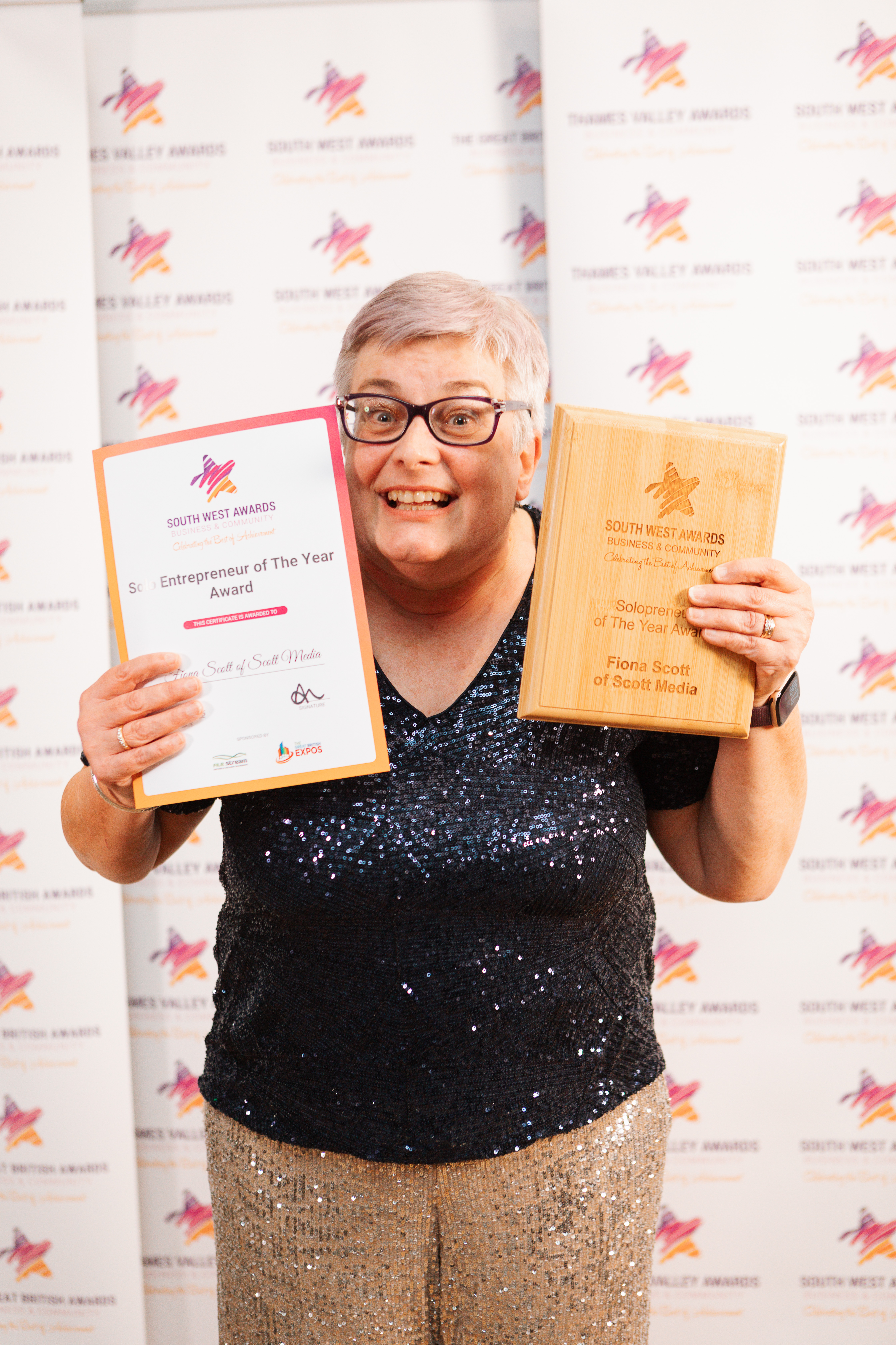 Fiona with her award for Solo Entrepreneur of the Year 2025 