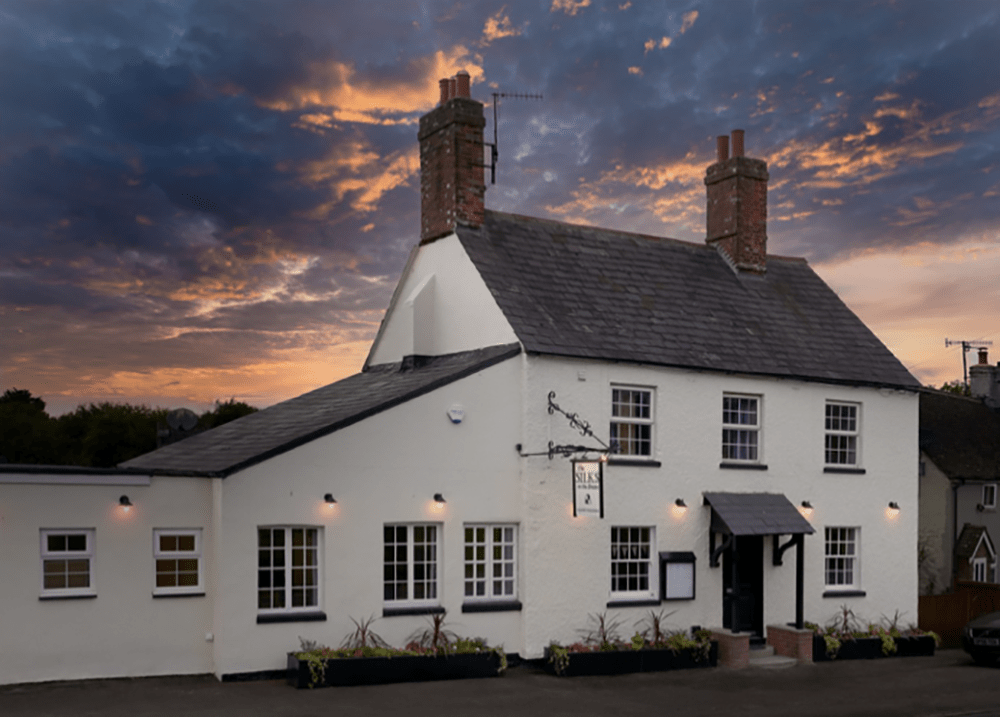 Historic pub saved by community reopens