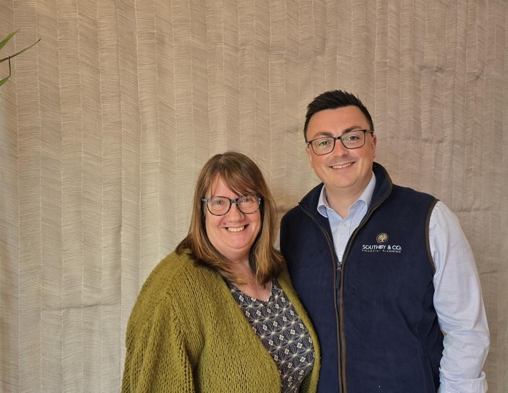 David Southby of  Southby Financial Planning Co, with Dawn Prosser of Swindon Night Shelter who has been gifted a donation to help improve the community garden