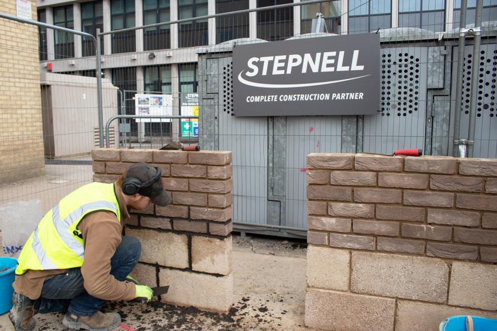 Josh Jackson, a L2 student at New College Swindon, demonstrates his bricklaying skills by building brick wall samples