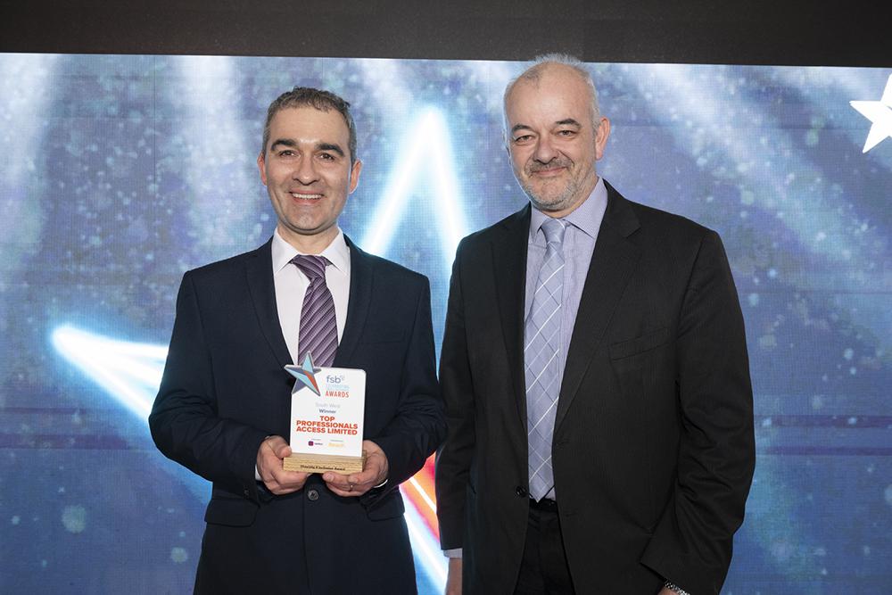 Sebastian Kopanski, left, receives the Diversity and Inclusion Award from FSB regional policy champion Craig Carey-Clinch
