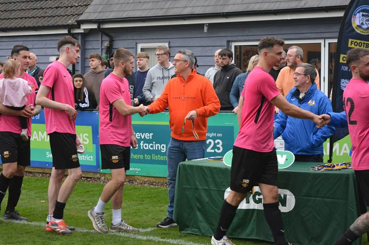 Vygon’s Dale Keegan hands out medals to players