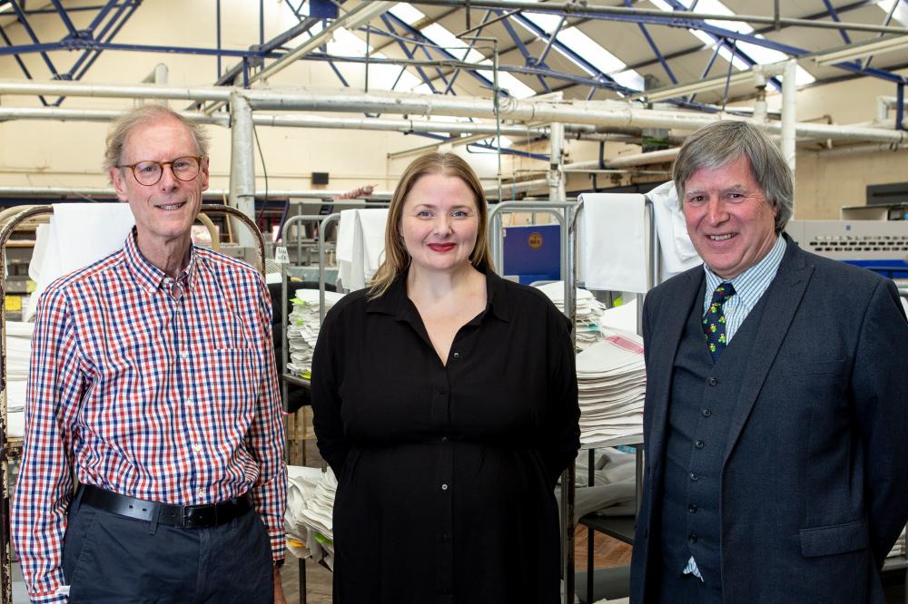 Robert Swan, left, and Clive Jones of K Laundry Ltd with Jessica Painter of Watersheds