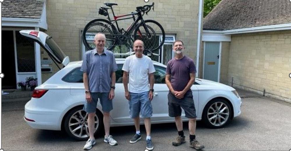 Dr Lee Rayfield (pictured in the centre) has started his fundraising cycle journey