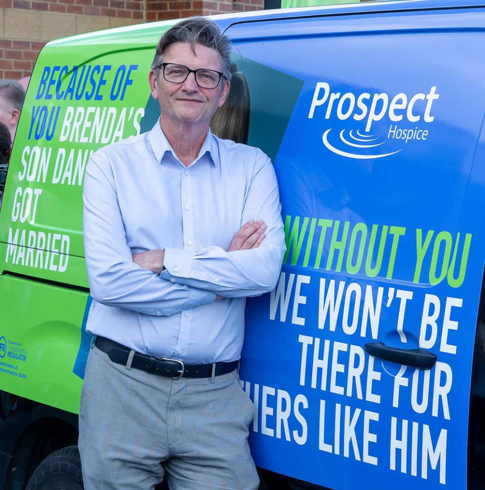 Prospect Hospice CEO Jeremy Lune with a van