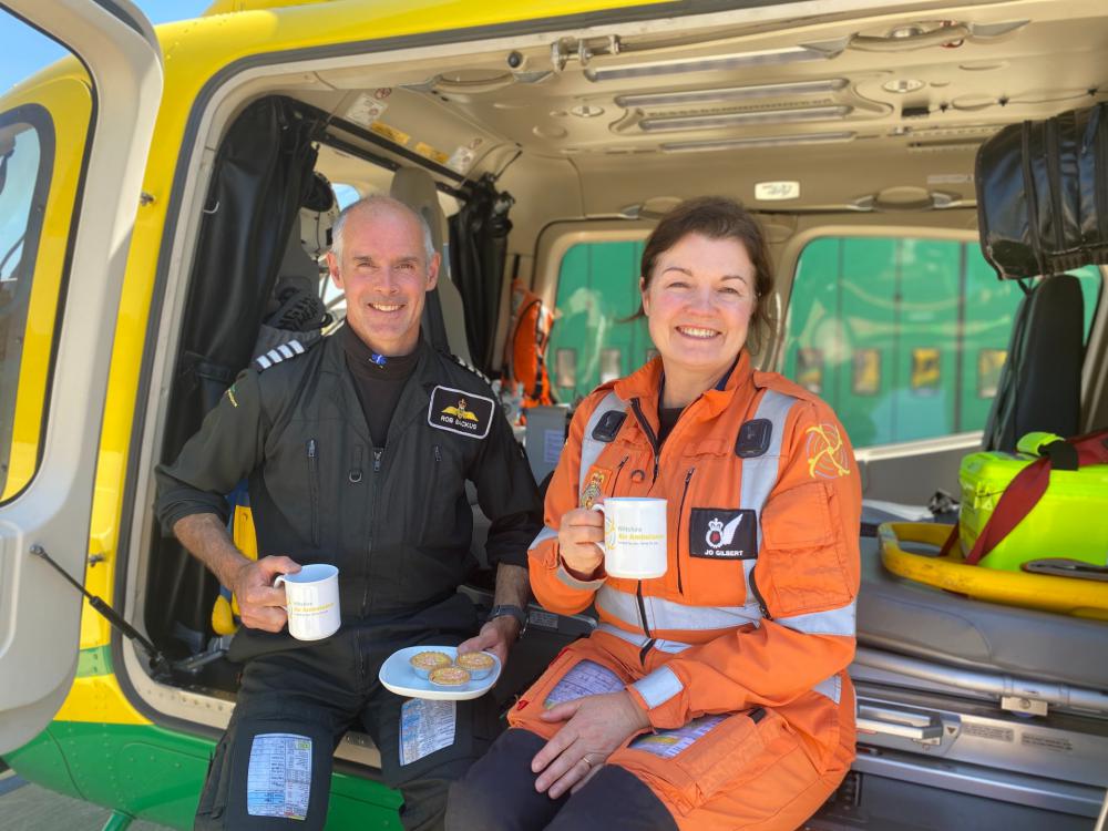 Pilot Rob Backus and Critical Care Paramedic Jo Gilbert enjoy a brew at the airbase