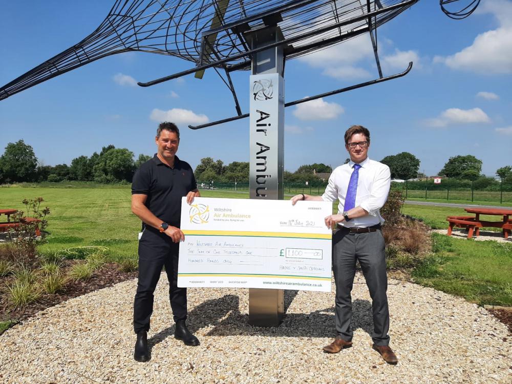 WAA Fundraising Manager Des Regan accepts the cheque from Haine & Smith Partner and Technical Director Thomas Pears