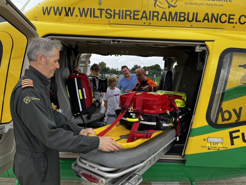 Maxi Bastable, centre, visited Wiltshire Air Ambulance HQ with his family