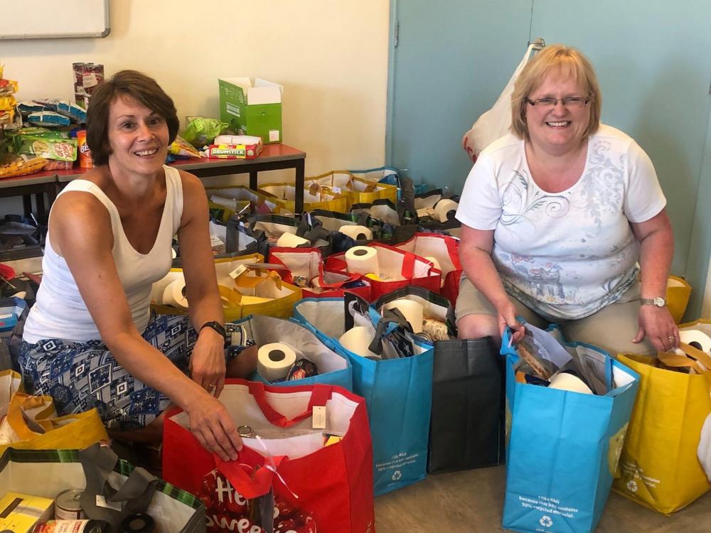Gorse Hill Baptist Church volunteers Julie Harris, left, and Debs Burbidge packing Bags of Hope. Their work is being funded by the Wiltshire Community Foundation