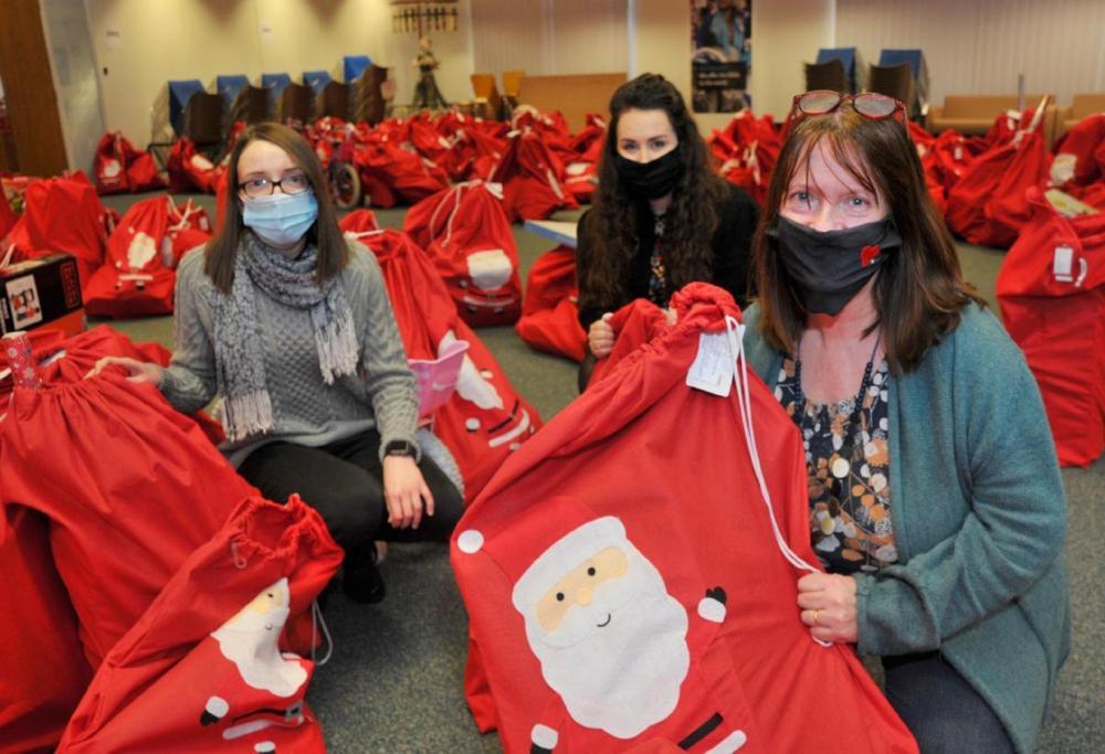 Swindon Toy Appeal volunteers packing gift sacks