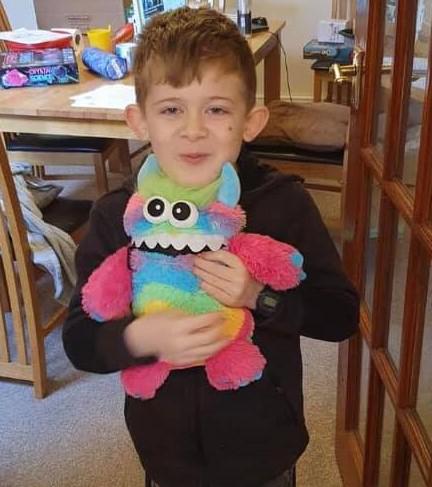 Children helped by the organisation include eight-year-old Nicholas, pictured with his 'worry monster'