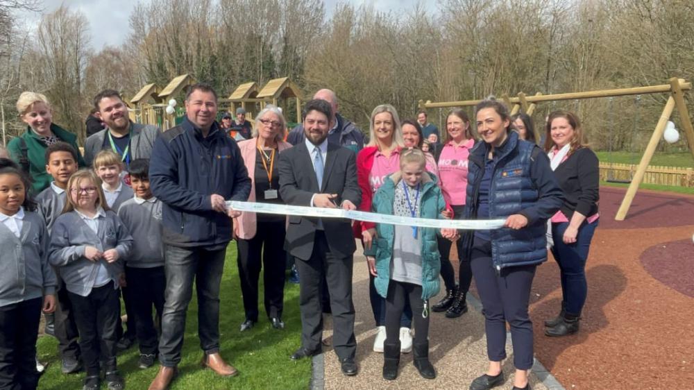 Cllr Matty Courtliff cutting the ribbon with Mums on a Mission and ESP Play Parks