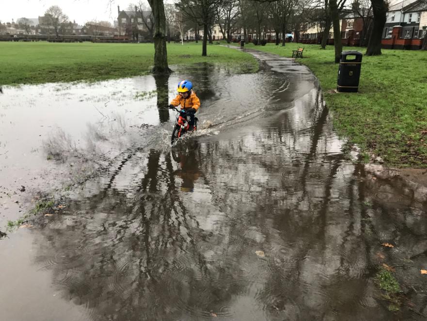 Becky's son Rafe using recently-gained cycling skills to enjoy the outdoors whatever the weather