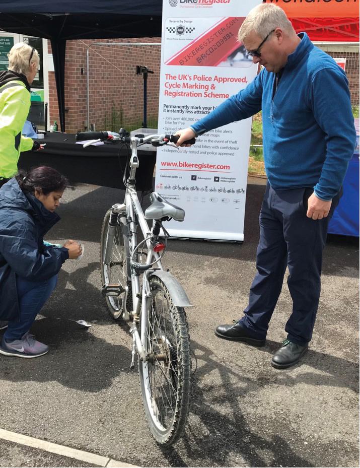 Images from an event at Badbury Park offering free bike repairs and security marking
