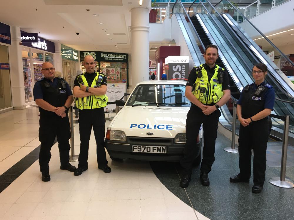 Policing team and classic police car: L-R: PCSO Patch Swindle, Sgt David Tippetts, PC Paul Bezzant and  PCSO Hannah Millward. 