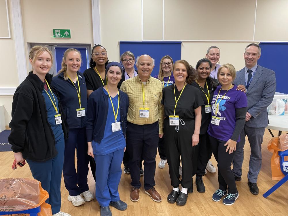 Mr Iravani, owner of Abbey Meads Dental Practice with his team