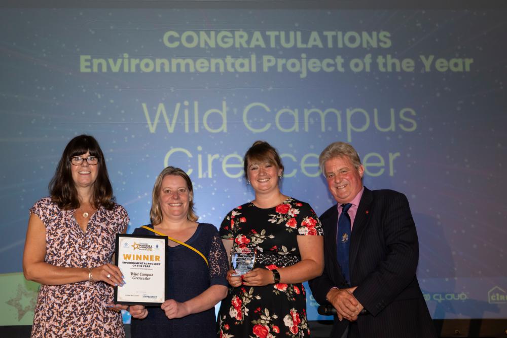 (L-R) The winning Wild Campus team – Annabel Carter from Cirencester College, Deb Govier and Rebecca Elton from the Royal Agricultural University - with their certificate and trophy, and Lord Bathurst, sponsor of the Environmental Project of the Year award (Image credit Kay Ransom Photography) 