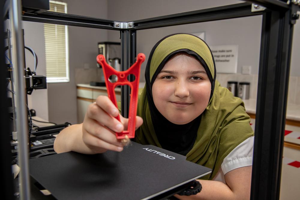 Aysha with her 3D printed vehicle adaptation