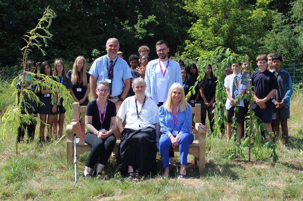 Andy Bull and pupils with representatives from HtFMeUs officially open the Garden of Sanctuary
