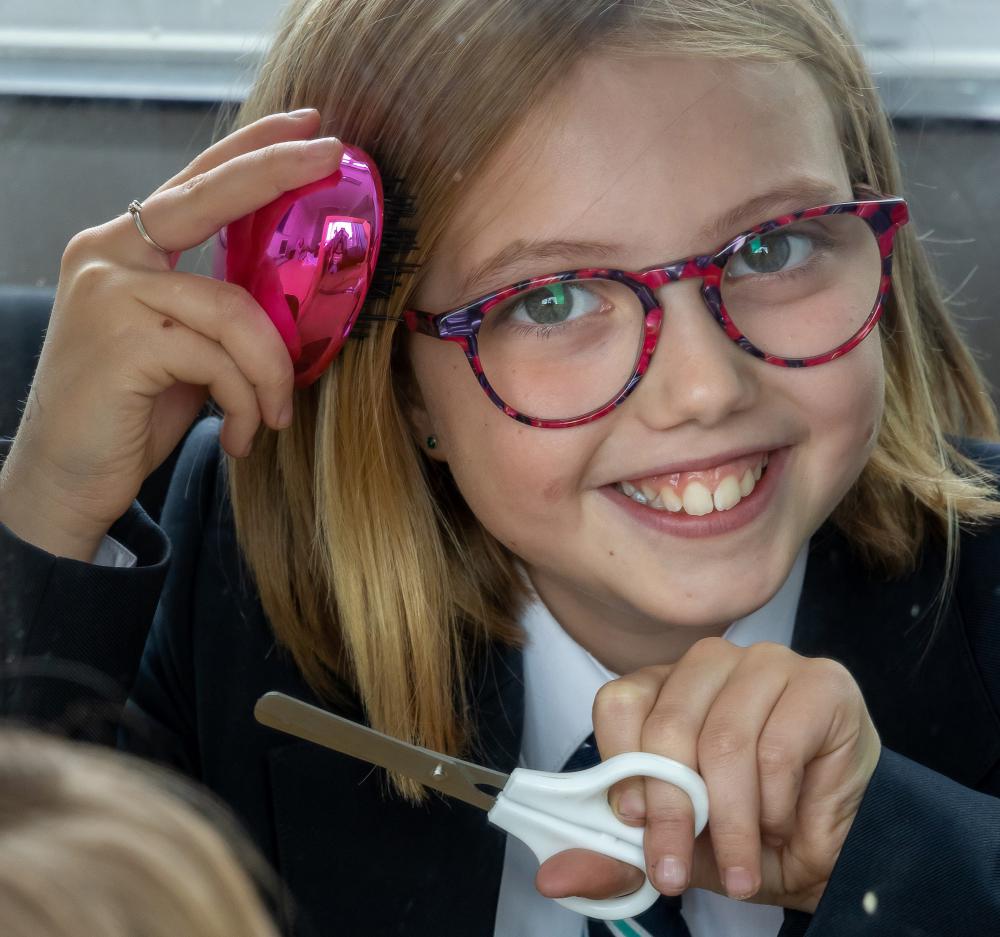Lawn Manor pupil chops locks for charity