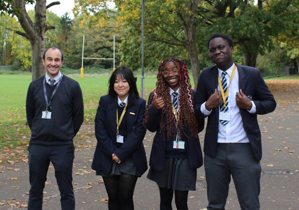 Teacher Alex Gasche with pupils Mangmaa, Delores and Cornel