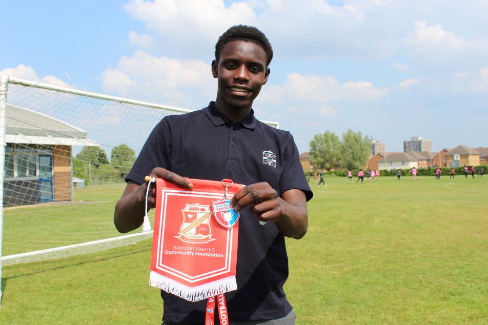 Bubacarr with his Barcelona Cup medal and STFC Player Ambassador pennant