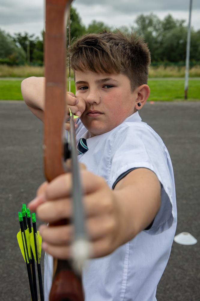 Lawn Manor student Logan practising his archery skills